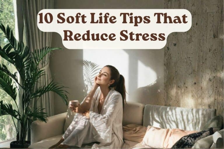 Woman sitting on a light-colored sofa in a sunlit room, holding a cup and gazing peacefully toward the window. Indoor plants and soft neutral decor create a calm, stress-free atmosphere. Text overlay reads: '10 Soft Life Tips That Reduce Stress'