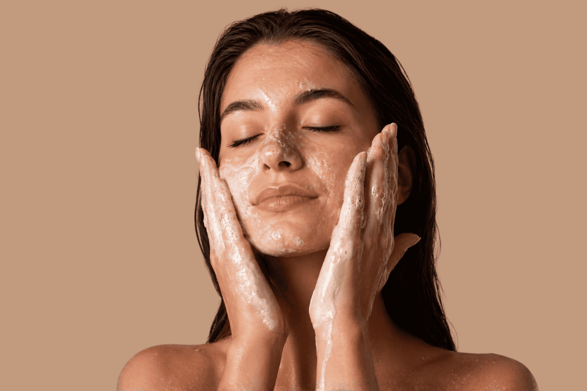 Woman applying skincare product, minimal skincare routine for beginners.