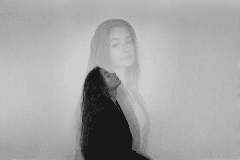 A double‑exposure portrait of a woman in profile with eyes closed, symbolizing introspection and emotional balance.