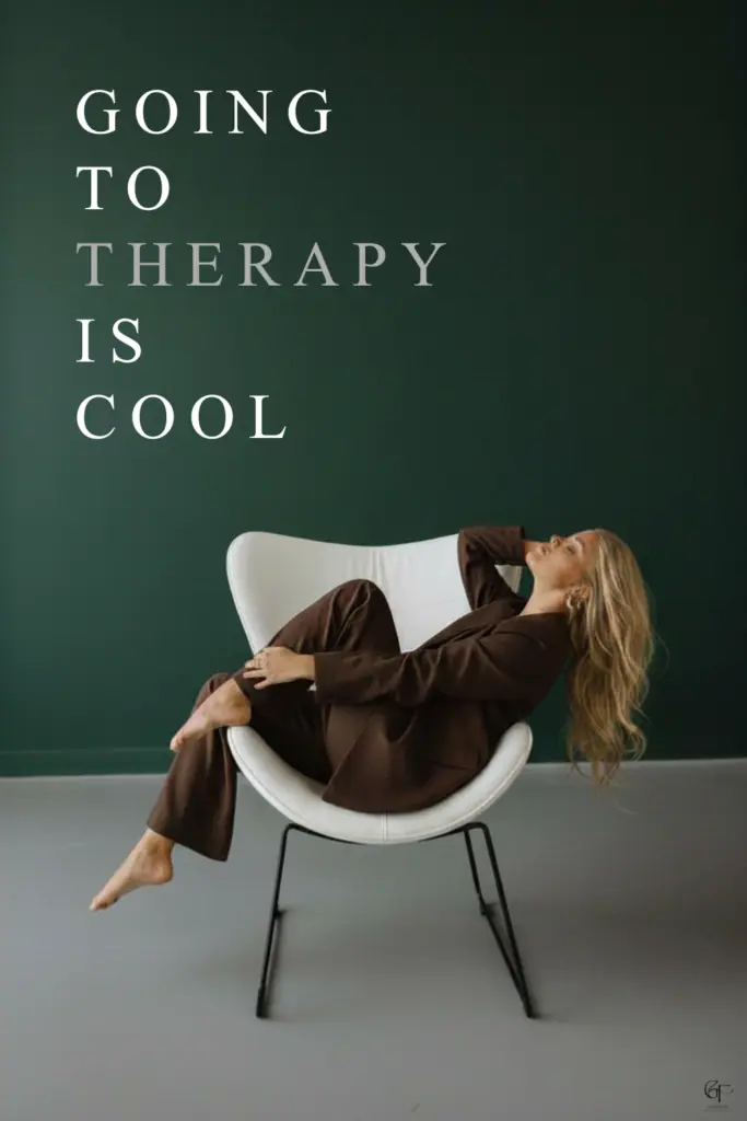 A person sitting relaxed in a modern white chair against a dark green wall, with text promoting the message that going to therapy is cool.