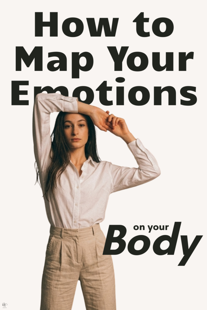 A person wearing a white button‑up shirt and beige high‑waisted pants stands against a light background with arms raised in a relaxed pose. Large black text beside them reads “How to Map Your Emotions on Your Body,” serving as a clean, minimalist cover image for an article about body‑based emotional awareness.