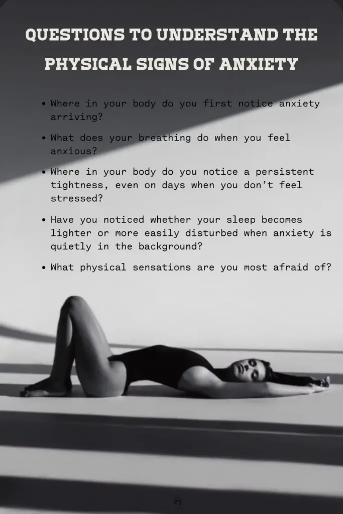 A grayscale image of a person lying on the floor with arms stretched overhead, light and shadow creating a dramatic mood. Text above the image lists questions about noticing physical signs of anxiety in the body.