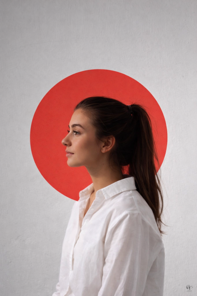 Person in profile wearing a white shirt, framed by a red circle on a light gray background.